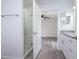 Well-lit bathroom with a marble tiled walk-in shower, granite counters, and sleek fixtures at 2240 Center St, Sanford, FL 32771