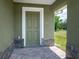 Close-up of the front door with decorative stone accents and a brick paver porch at 2240 Center St, Sanford, FL 32771