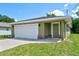 Charming single-story home with a brick paver driveway and an attached one-car garage at 2240 Center St, Sanford, FL 32771