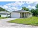 A charming single-story home with a well-maintained lawn and a concrete driveway at 2240 Center St, Sanford, FL 32771