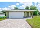 Charming single-story home with a brick paver driveway and an attached one-car garage at 2240 Center St, Sanford, FL 32771