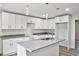 Contemporary kitchen with granite countertops, white cabinetry, and pendant lighting at 2240 Center St, Sanford, FL 32771