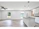 Beautiful kitchen with granite countertops, white cabinets, and stainless steel faucet at 2240 Center St, Sanford, FL 32771