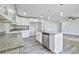 Kitchen with granite counters, white cabinets, stainless appliances, and open to living area at 2240 Center St, Sanford, FL 32771
