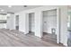Well lit laundry room with gray toned vinyl flooring and washer/dryer hookups at 2240 Center St, Sanford, FL 32771