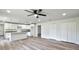 Spacious and bright open living area with modern kitchen featuring white cabinets at 2240 Center St, Sanford, FL 32771
