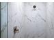 Close-up of a modern shower with elegant marble-look tile, sleek hardware, and contemporary design at 2240 Center St, Sanford, FL 32771