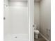 Bathroom featuring a tiled walk-in shower and a view of the toilet area, complete with modern fixtures at 1709 Forest Run Ln, Auburndale, FL 33823