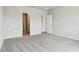 Bedroom with neutral colored walls and carpet, showing doorways to other rooms in the home at 1709 Forest Run Ln, Auburndale, FL 33823