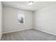 Comfortable bedroom featuring plush carpeting, neutral paint, a window, and ample space at 1709 Forest Run Ln, Auburndale, FL 33823