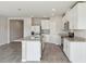 Beautiful kitchen featuring stainless steel appliances, a center island, granite counters, and tile floors at 1709 Forest Run Ln, Auburndale, FL 33823