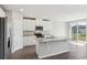 Beautiful kitchen featuring stainless steel appliances, a center island, granite counters, and tile floors at 1709 Forest Run Ln, Auburndale, FL 33823