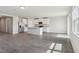 Open-concept kitchen featuring stainless steel appliances, a center island, granite counters, and tile floors at 1709 Forest Run Ln, Auburndale, FL 33823