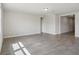 Bright and spacious living room features neutral paint, tile floors, recessed lighting, and large windows at 1709 Forest Run Ln, Auburndale, FL 33823