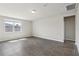 Bright and spacious living room features neutral paint, tile floors, recessed lighting, and large windows at 1709 Forest Run Ln, Auburndale, FL 33823