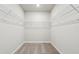 A walk-in closet featuring wire shelving for optimal organization and neat storage of personal items at 1709 Forest Run Ln, Auburndale, FL 33823