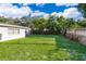 Spacious backyard with grassy area and wooden fence at 117 E Lauren Ct, Fern Park, FL 32730