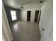 Spacious bedroom featuring neutral tile flooring, a ceiling fan, and a single window at 821 Savona Pl, Kissimmee, FL 34758