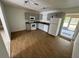 A kitchen with neutral cabinets, laminate countertops, white appliances, and wood-look flooring at 821 Savona Pl, Kissimmee, FL 34758