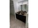 Bathroom featuring double vessel sinks and a granite countertop at 1780 Converse Ct, Deltona, FL 32738