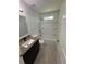 Clean bathroom features granite vanity top and a shower-tub combo at 1780 Converse Ct, Deltona, FL 32738