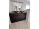 Modern bathroom vanity with dual vessel sinks and stone countertop, complemented by stylish light fixtures at 1780 Converse Ct, Deltona, FL 32738