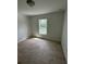 This is a shot of a bedroom featuring a window and light colored tile flooring at 1780 Converse Ct, Deltona, FL 32738