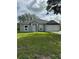 Charming single-story home with a well-manicured lawn and attached two car garage at 1780 Converse Ct, Deltona, FL 32738