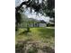 Charming home with a well-kept lawn, mature trees, and a two-car garage at 1780 Converse Ct, Deltona, FL 32738