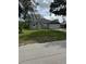 Attractive single-story home with a freshly painted exterior, a two-car garage, and a well-maintained lawn at 1780 Converse Ct, Deltona, FL 32738