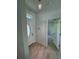 Bright foyer features decorative door, stylish light fixture, and neutral tile flooring at 1780 Converse Ct, Deltona, FL 32738
