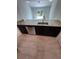 Modern kitchen showcasing granite countertops, stainless steel appliances, and a stylish sink with a designer faucet at 1780 Converse Ct, Deltona, FL 32738