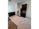 Contemporary kitchen featuring stainless steel refrigerator and appliances, granite countertops, and tile flooring at 1780 Converse Ct, Deltona, FL 32738