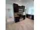 Modern kitchen with dark cabinetry and stainless steel appliances at 1780 Converse Ct, Deltona, FL 32738