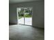 Bright living room featuring sliding glass doors and neutral tile flooring at 1780 Converse Ct, Deltona, FL 32738