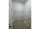 Spacious walk-in closet with wire shelving and tile floors at 1780 Converse Ct, Deltona, FL 32738