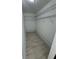 Large walk-in closet with wire shelving and tile floors at 1780 Converse Ct, Deltona, FL 32738