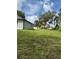 Spacious yard with mature trees, and partial home exterior views at 1780 Converse Ct, Deltona, FL 32738