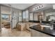 Bright bathroom featuring a soaking tub, separate shower, and dual sink vanity with black countertops at 8300 Ludington Cir, Orlando, FL 32836