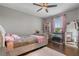 Stylish bedroom featuring a plush bed, mirrored decor, and lots of natural light at 8300 Ludington Cir, Orlando, FL 32836