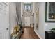 An inviting entryway features a soaring ceiling, modern lighting, and wood flooring, creating a grand entrance at 8300 Ludington Cir, Orlando, FL 32836