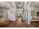 A grand foyer showcases a high ceiling, modern lighting, and an open layout with seamless transitions to other rooms at 8300 Ludington Cir, Orlando, FL 32836