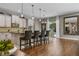 Open kitchen featuring an island with bar seating, modern appliances, and sleek finishes at 8300 Ludington Cir, Orlando, FL 32836