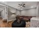Cozy living room features a plush sectional, a comfortable beanbag chair, and warm lighting creating a welcoming space at 8300 Ludington Cir, Orlando, FL 32836