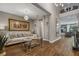 A bright and airy living room boasts elegant decor and plenty of natural light and an eye-catching chandelier at 8300 Ludington Cir, Orlando, FL 32836