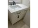 Elegant bathroom vanity with a sleek white countertop, modern fixtures, and ample storage space at 435 Caribbean Dr, Davenport, FL 33897