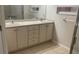 Bright bathroom featuring double sink vanity and shower with glass doors at 681 Coronado Dr, Kissimmee, FL 34759