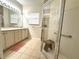 Bright bathroom with a large glass shower, double sink vanity, and tile flooring at 681 Coronado Dr, Kissimmee, FL 34759
