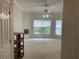 Bedroom with ceiling fan features natural lighting from windows at 681 Coronado Dr, Kissimmee, FL 34759