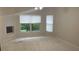 Bedroom features natural lighting from windows at 681 Coronado Dr, Kissimmee, FL 34759